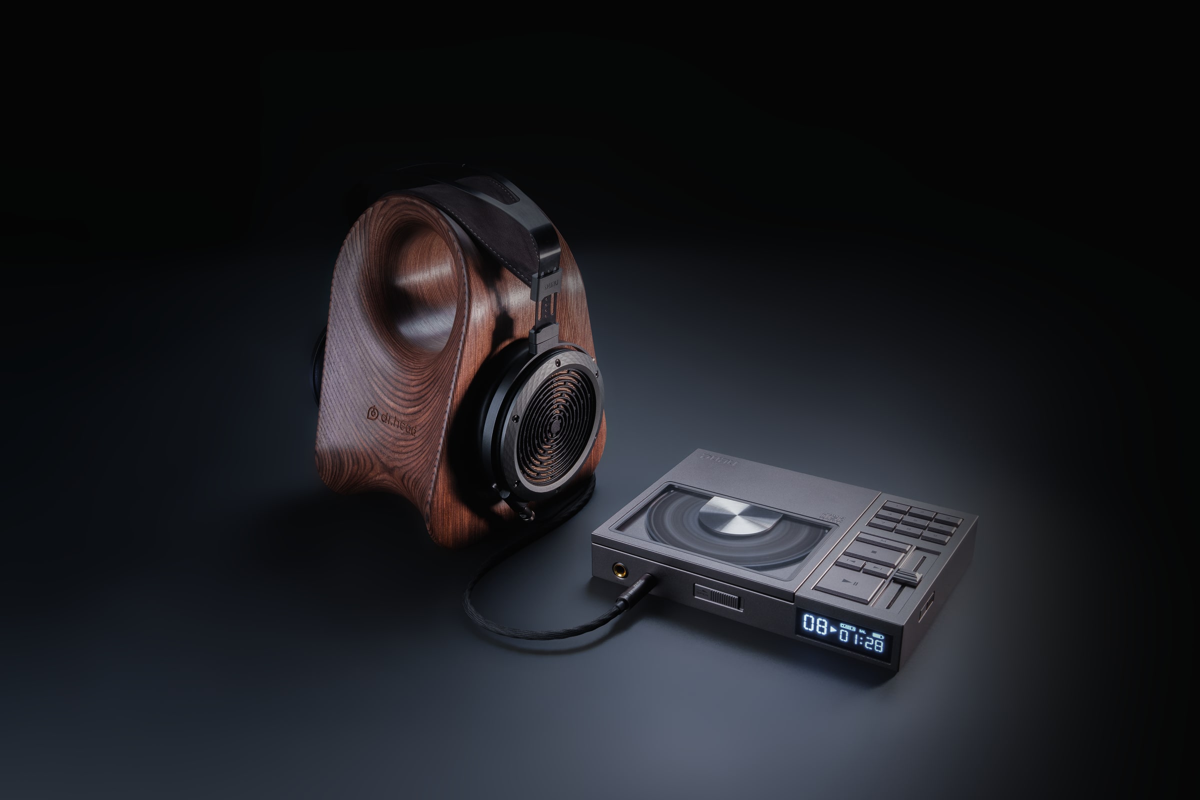 DUNU digital audio player photographed with wooden headphones